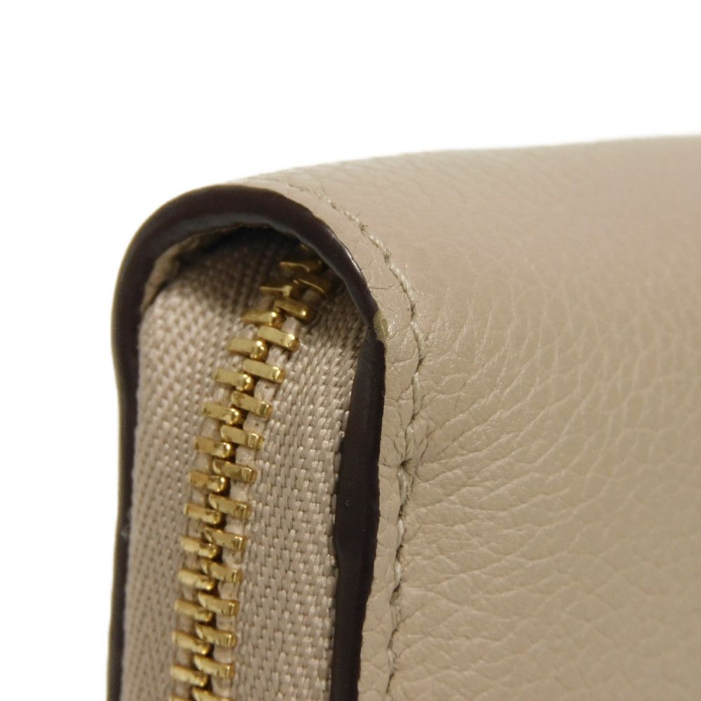 LOUIS VUITTON Coin case M80100 Grain calf leather (embossed) Gurege LV signature Lock me Zip around purse