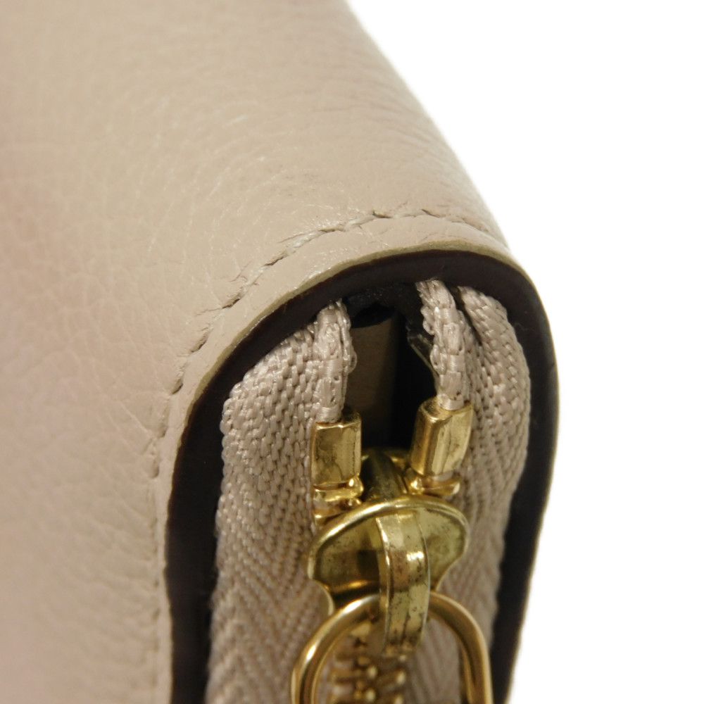 LOUIS VUITTON Coin case M80100 Grain calf leather (embossed) Gurege LV signature Lock me Zip around purse