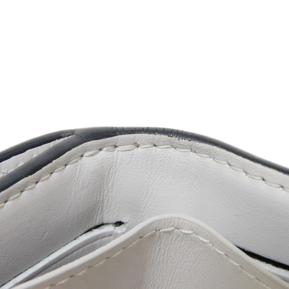 LOUIS VUITTON Tri-fold wallet M67621 Taiga leather x monogram canvas x smooth leather Bron LV Logo Flower White Monogram Discovery compact wallet mens Used Authentic