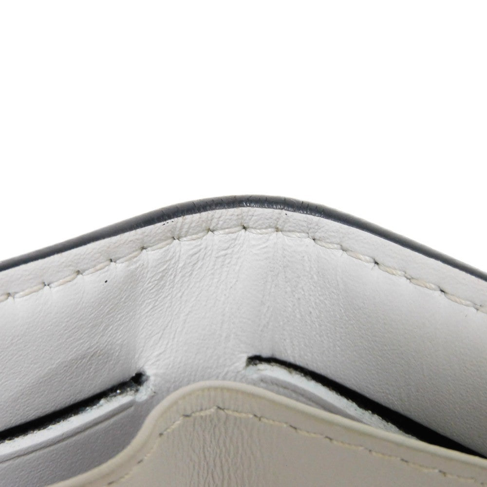 LOUIS VUITTON Tri-fold wallet M67621 Taiga leather x monogram canvas x smooth leather Bron LV Logo Flower White Monogram Discovery compact wallet mens Used Authentic