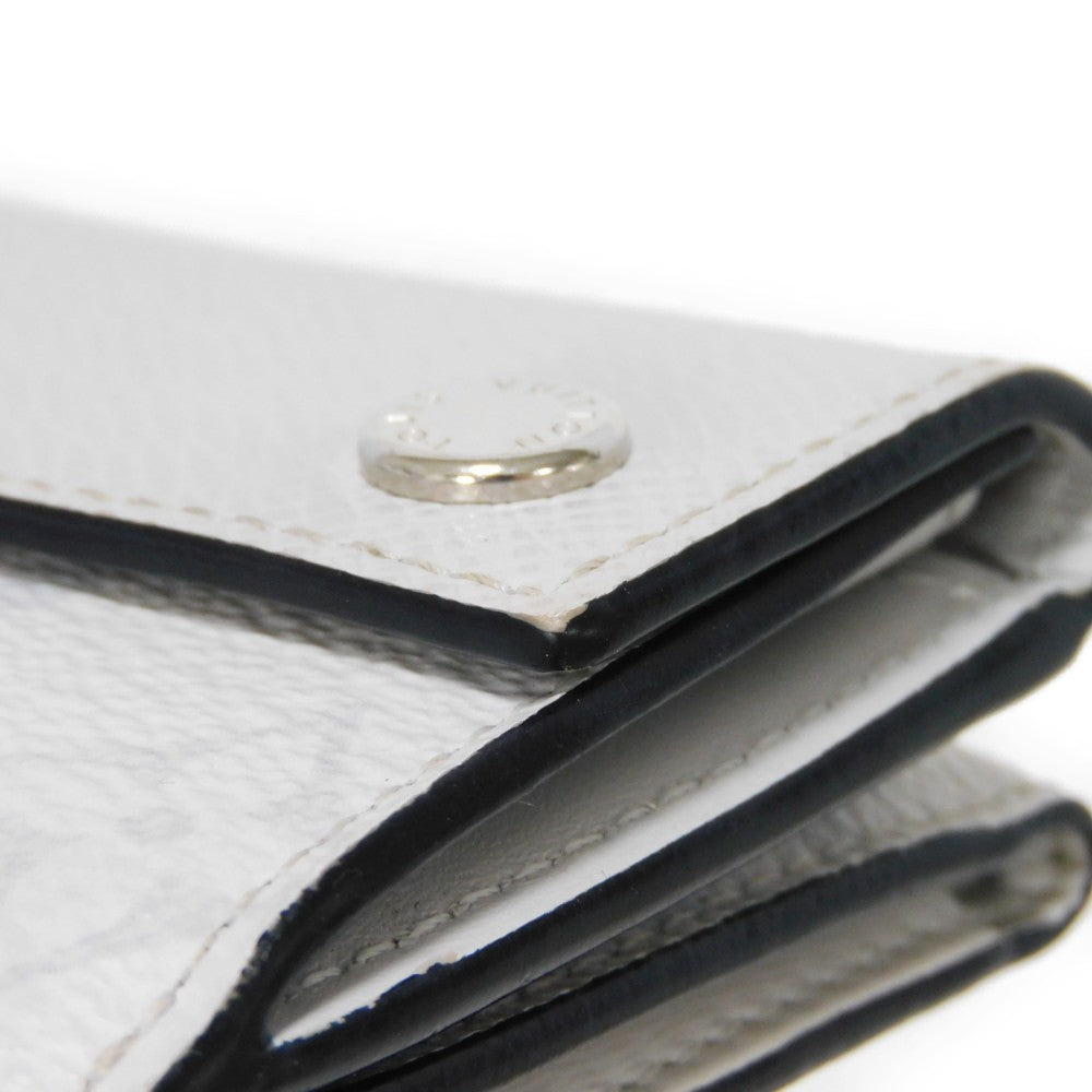 LOUIS VUITTON Tri-fold wallet M67621 Taiga leather x monogram canvas x smooth leather Bron LV Logo Flower White Monogram Discovery compact wallet mens Used Authentic