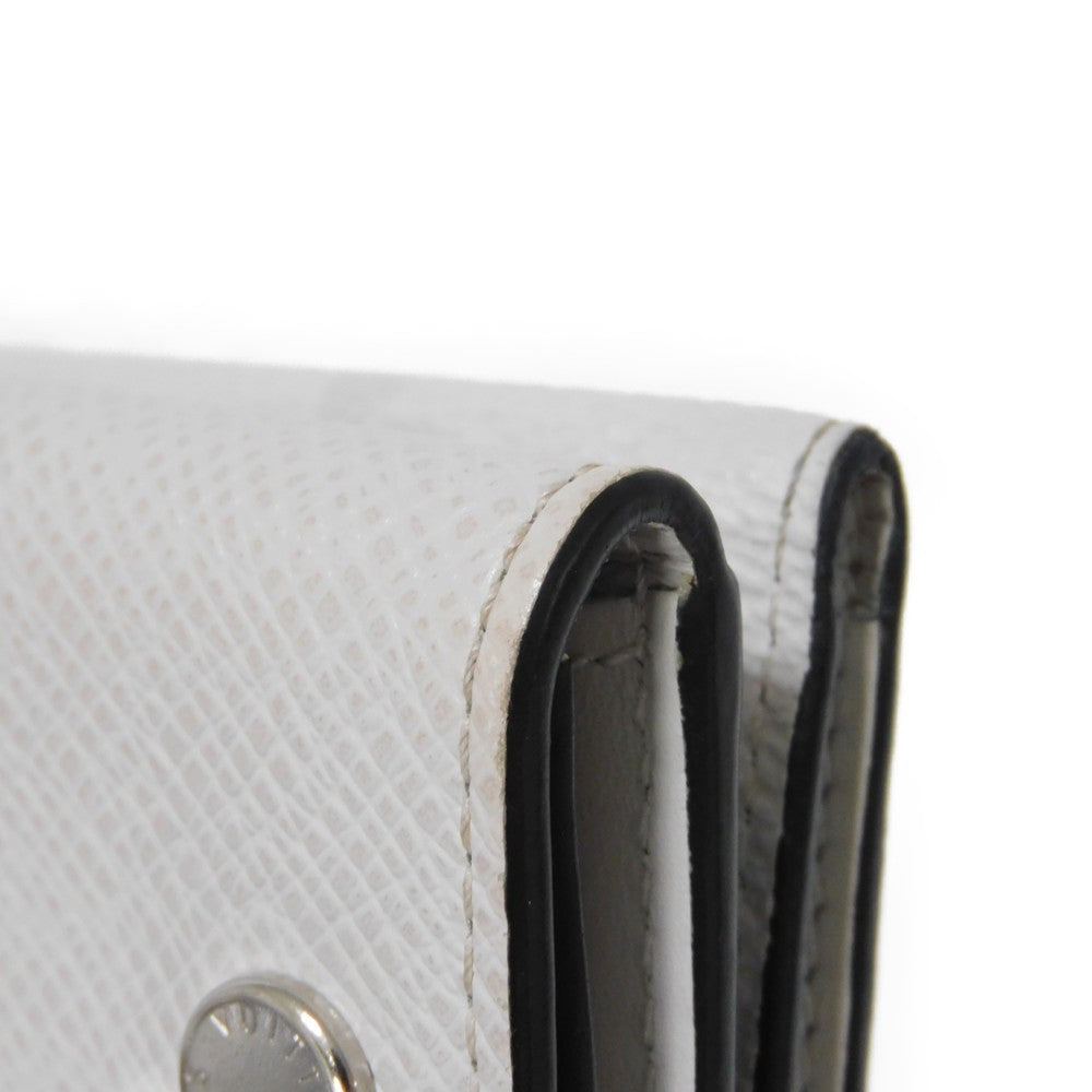 LOUIS VUITTON Tri-fold wallet M67621 Taiga leather x monogram canvas x smooth leather Bron LV Logo Flower White Monogram Discovery compact wallet mens Used Authentic