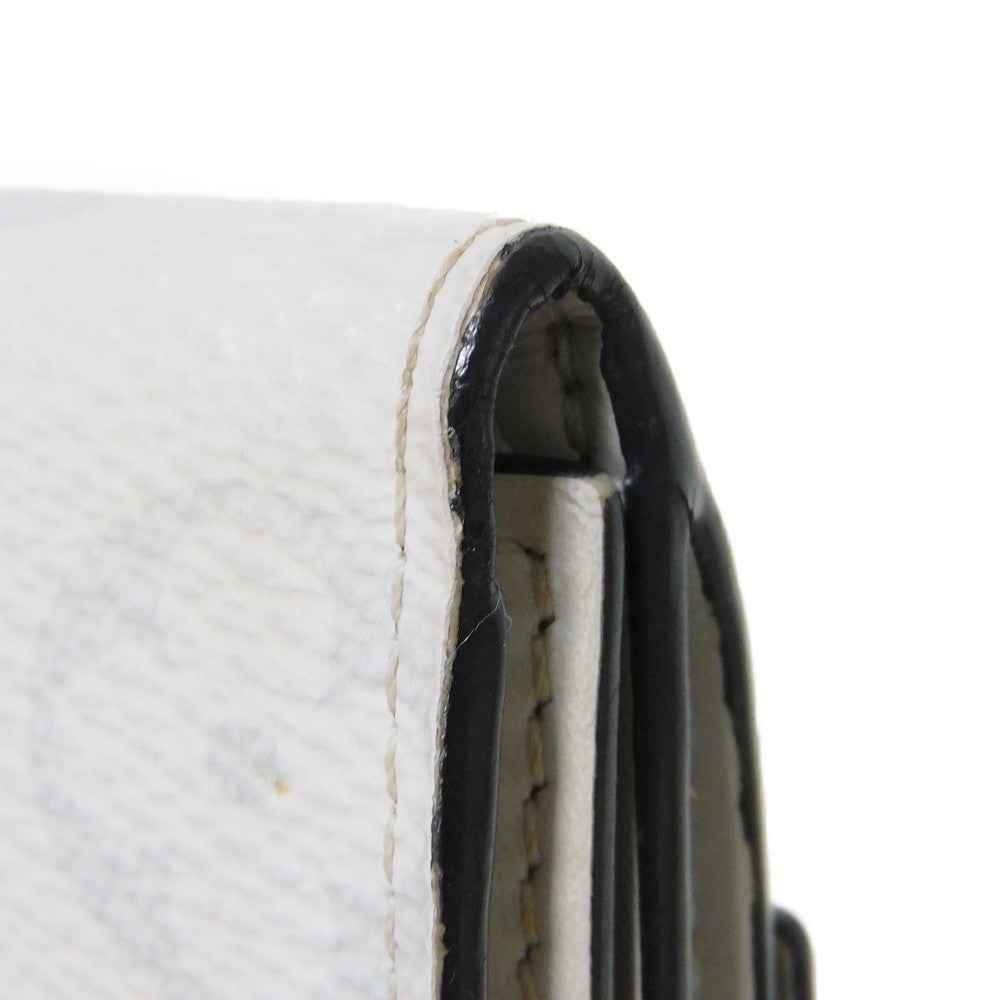 LOUIS VUITTON Tri-fold wallet M67621 Taiga leather x monogram canvas x smooth leather Bron LV Logo Flower White Monogram Discovery compact wallet mens Used Authentic