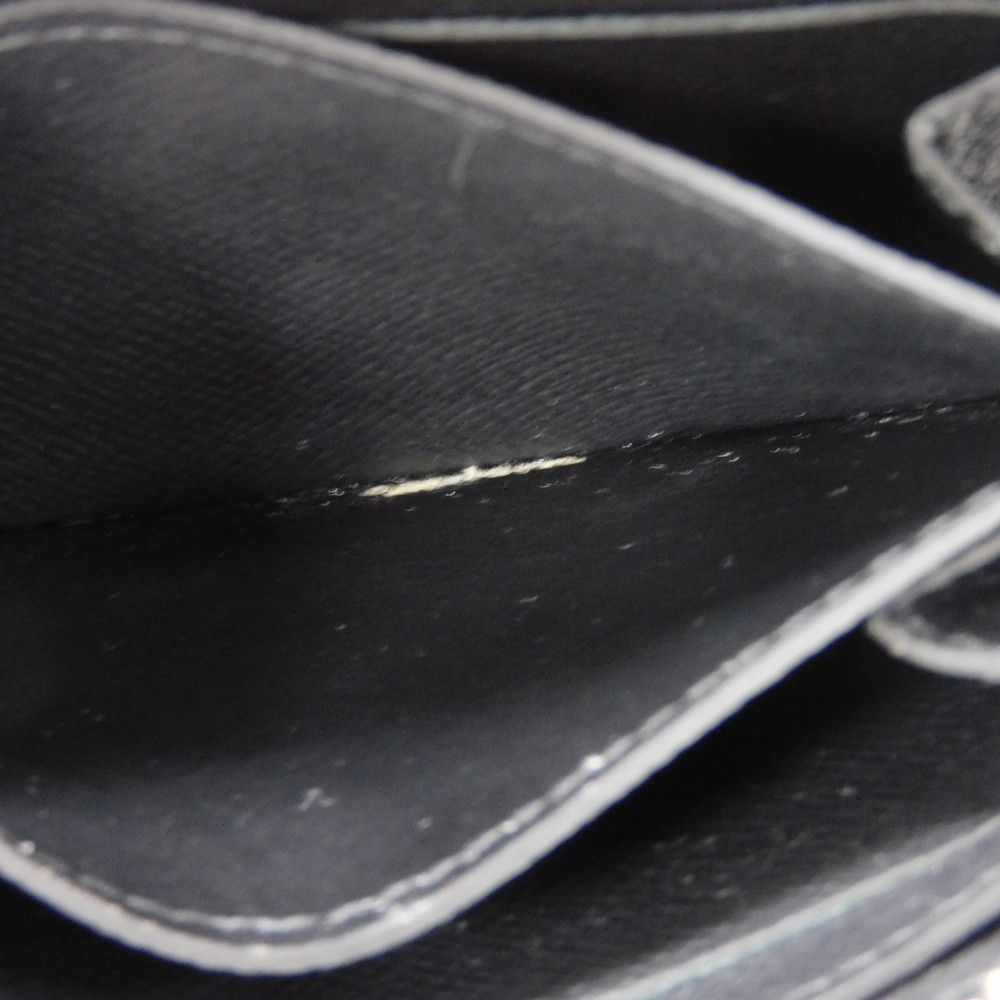 LOUIS VUITTON Coin case M30511 Taiga leather (embossed) Noir New LV logo embossed black Zip Around Taiga Zippy coin purse mens Used Authentic