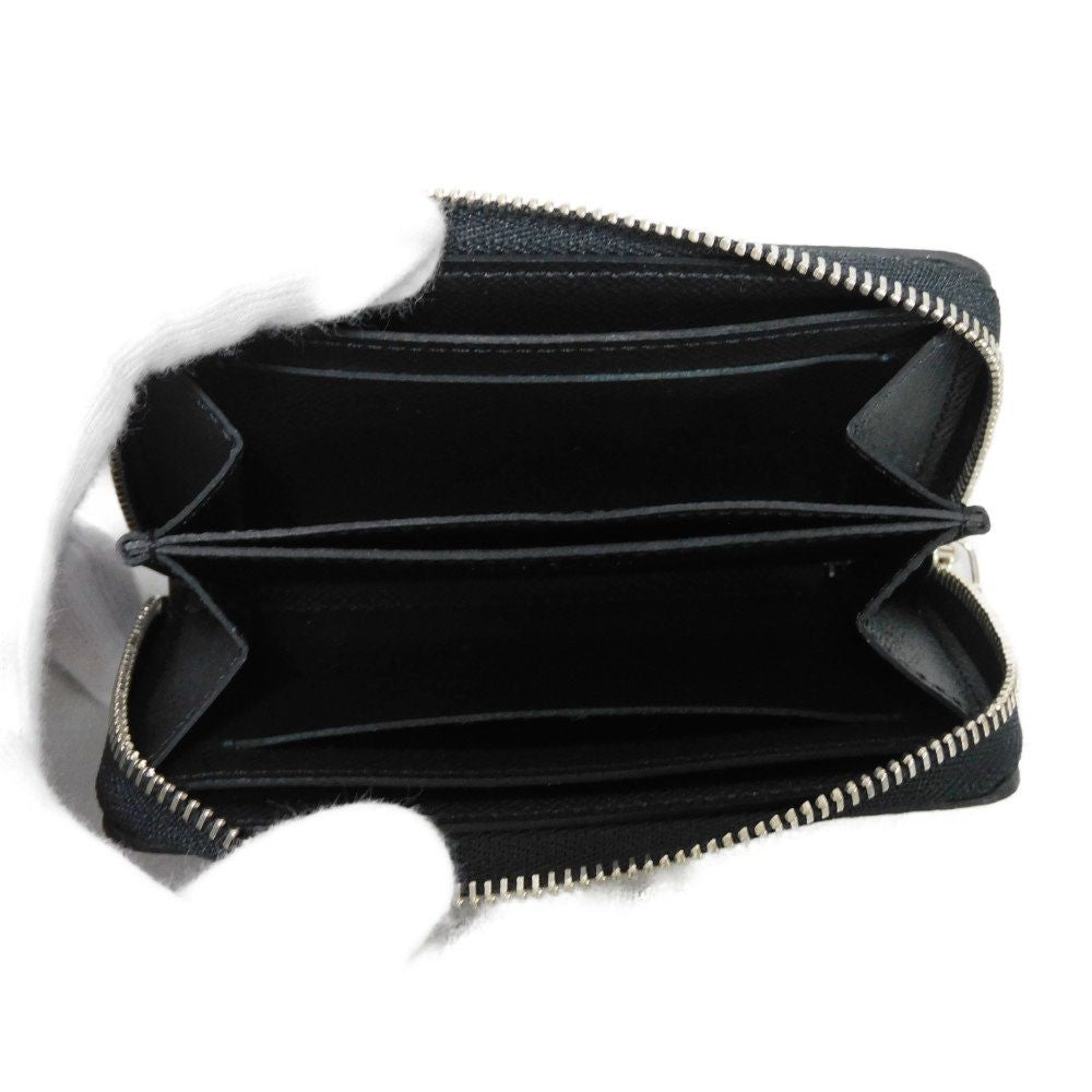 LOUIS VUITTON Coin case M30511 Taiga leather (embossed) Noir New LV logo embossed black Zip Around Taiga Zippy coin purse mens Used Authentic