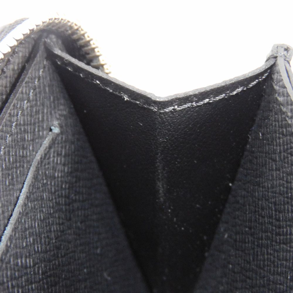 LOUIS VUITTON Coin case M30511 Taiga leather (embossed) Noir New LV logo embossed black Zip Around Taiga Zippy coin purse mens Used Authentic