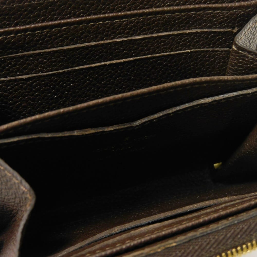 LOUIS VUITTON Coin case M60553 Implant leather (monogram embossed) Tail Monogram Unplant Zip around purse