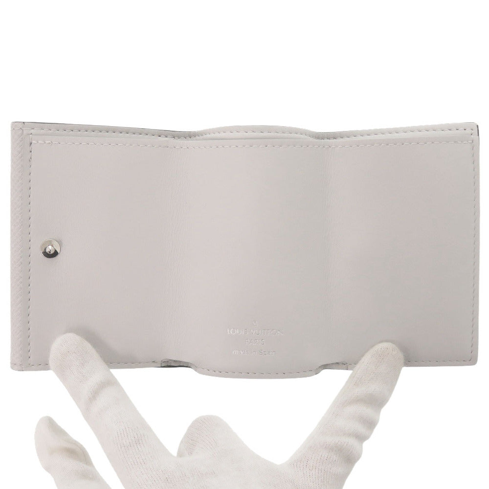 LOUIS VUITTON Tri-fold wallet M67621 Taiga white Monogram Taigalama Discovery Compact Wallet mens Used Authentic