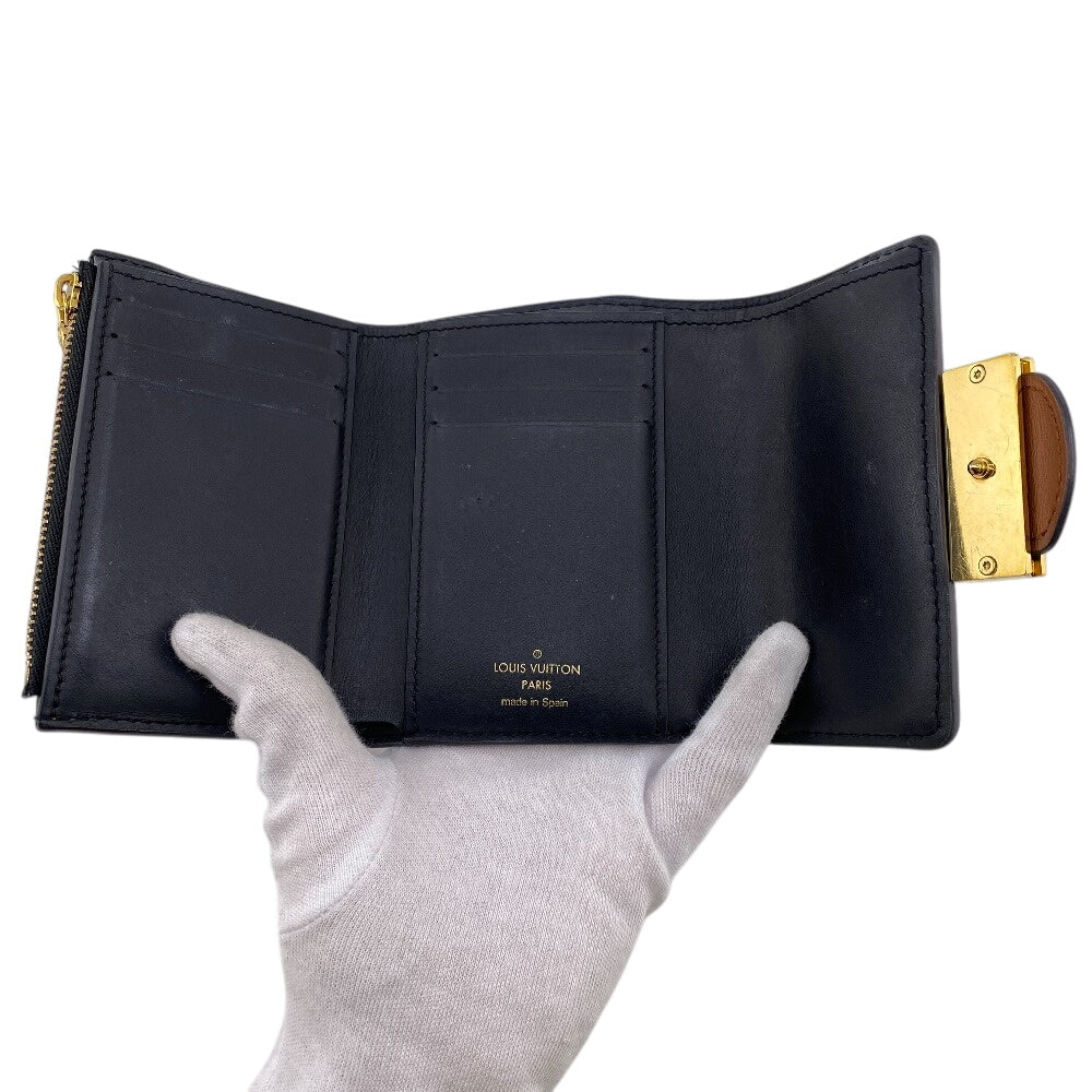 LOUIS VUITTON Tri-fold wallet M68725 leather Brown Monogram reverse Portefeuille Daufine Compact